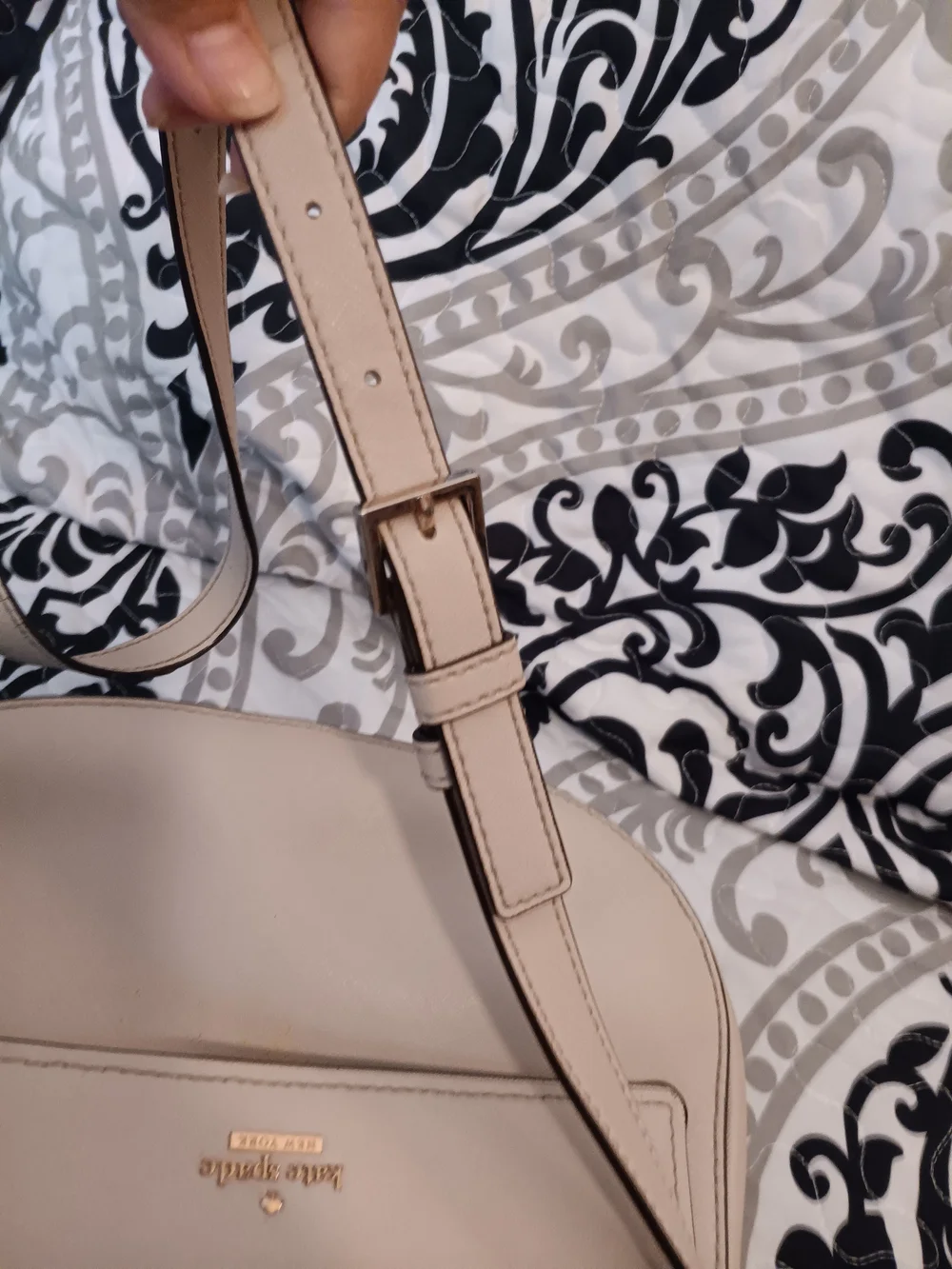 kate spade cream saddle crossbody with gold-tone logo